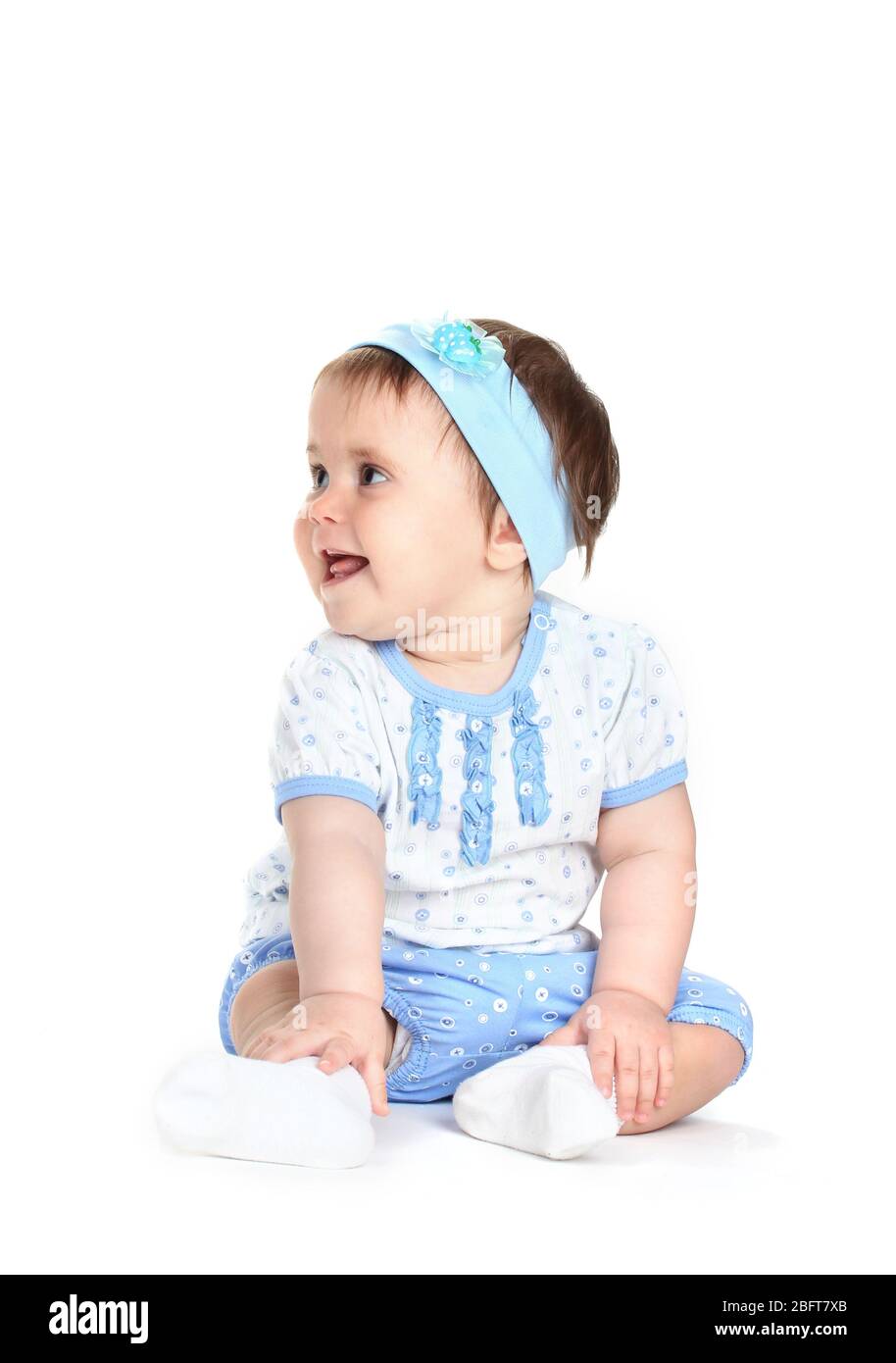 Cute baby girl sitting isolated on white Stock Photo - Alamy