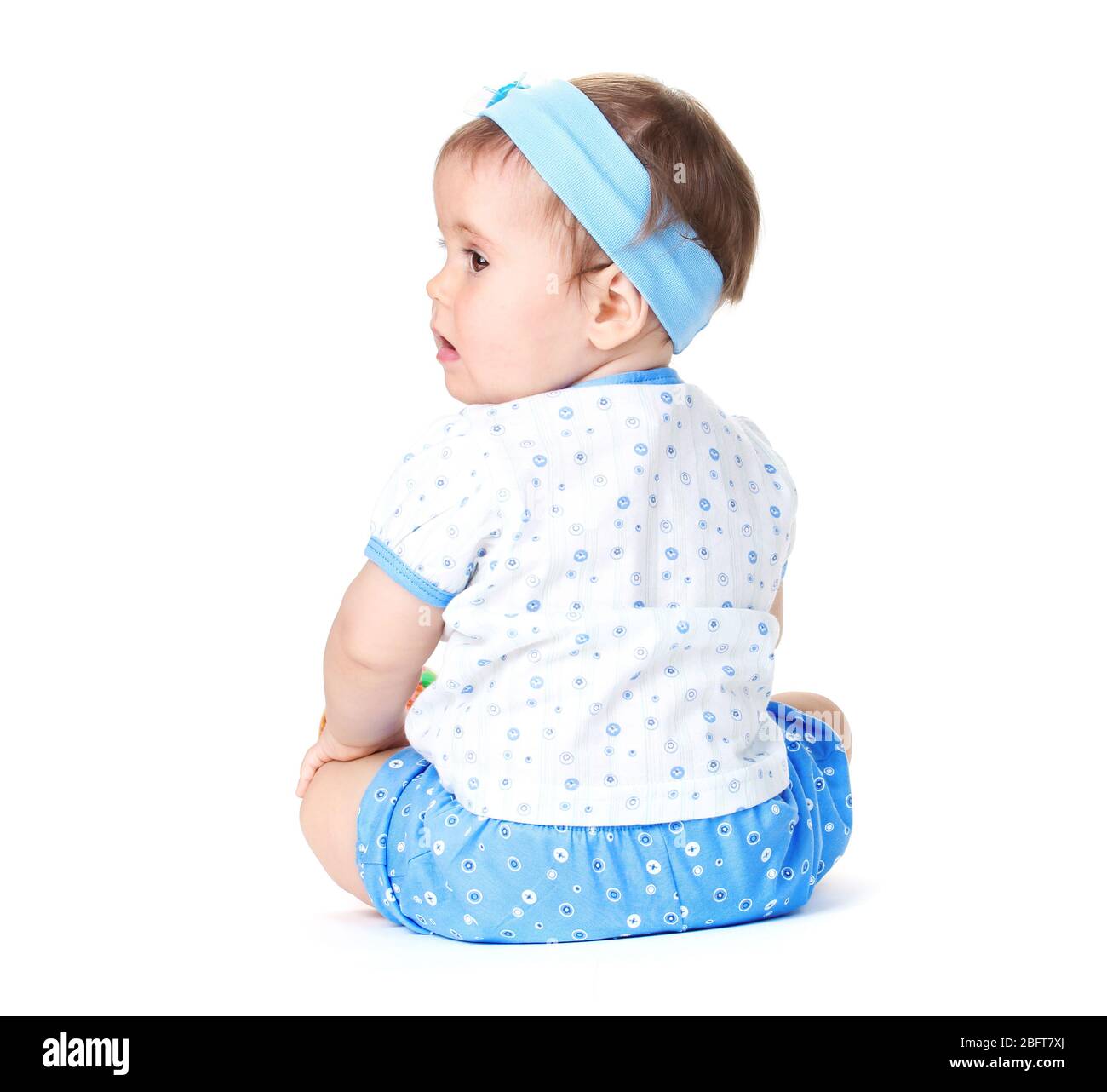 Cute baby girl sitting isolated on white Stock Photo - Alamy
