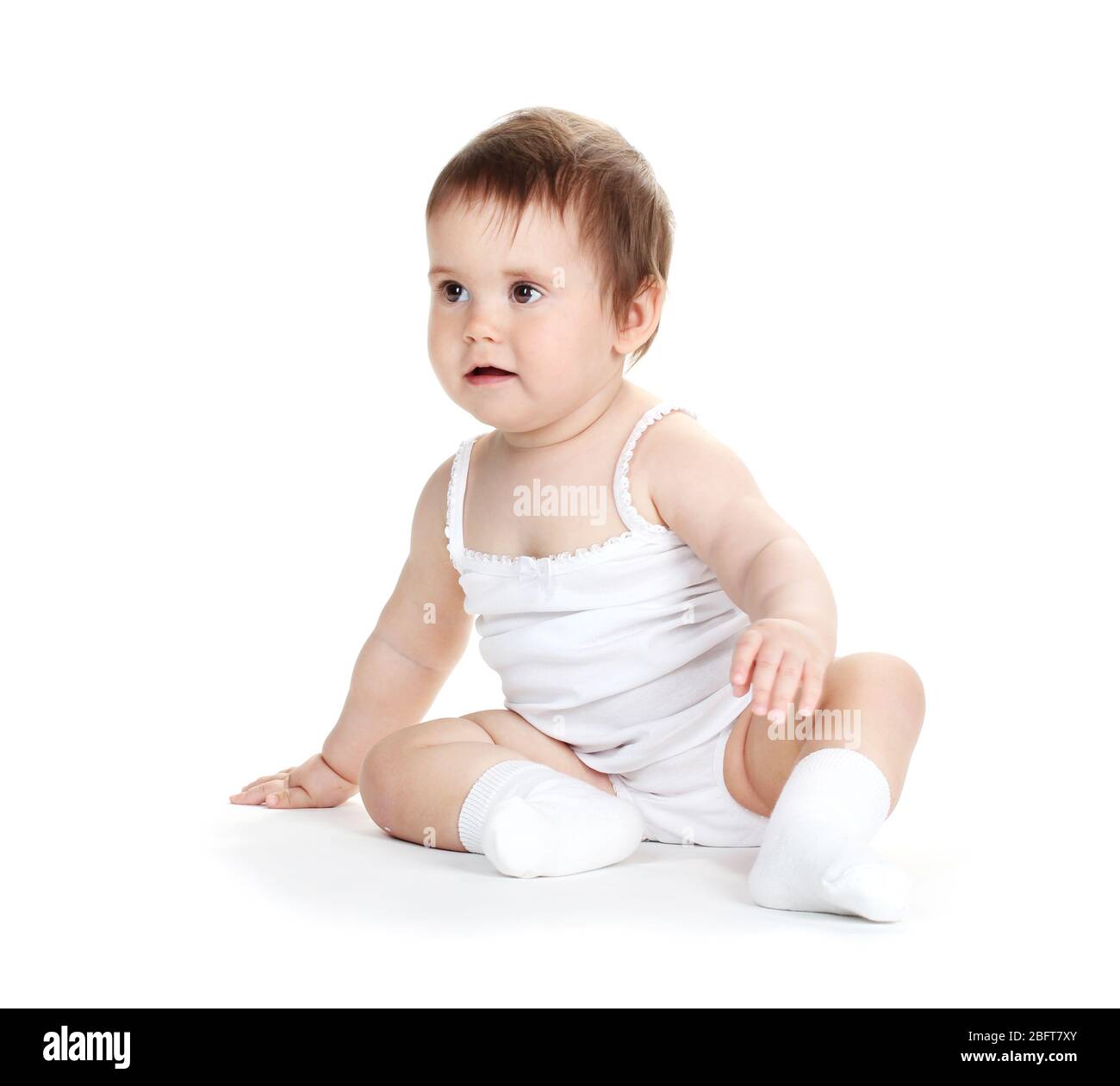Cute baby girl sitting isolated on white Stock Photo - Alamy