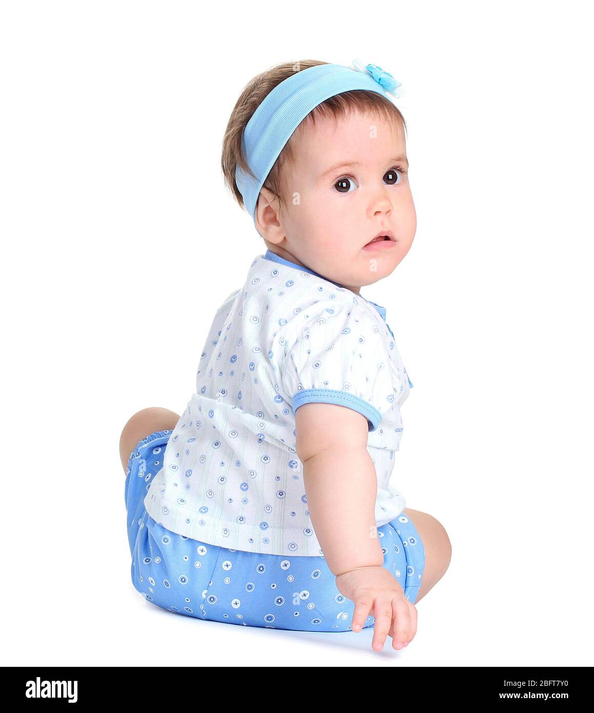Cute baby girl sitting isolated on white Stock Photo - Alamy