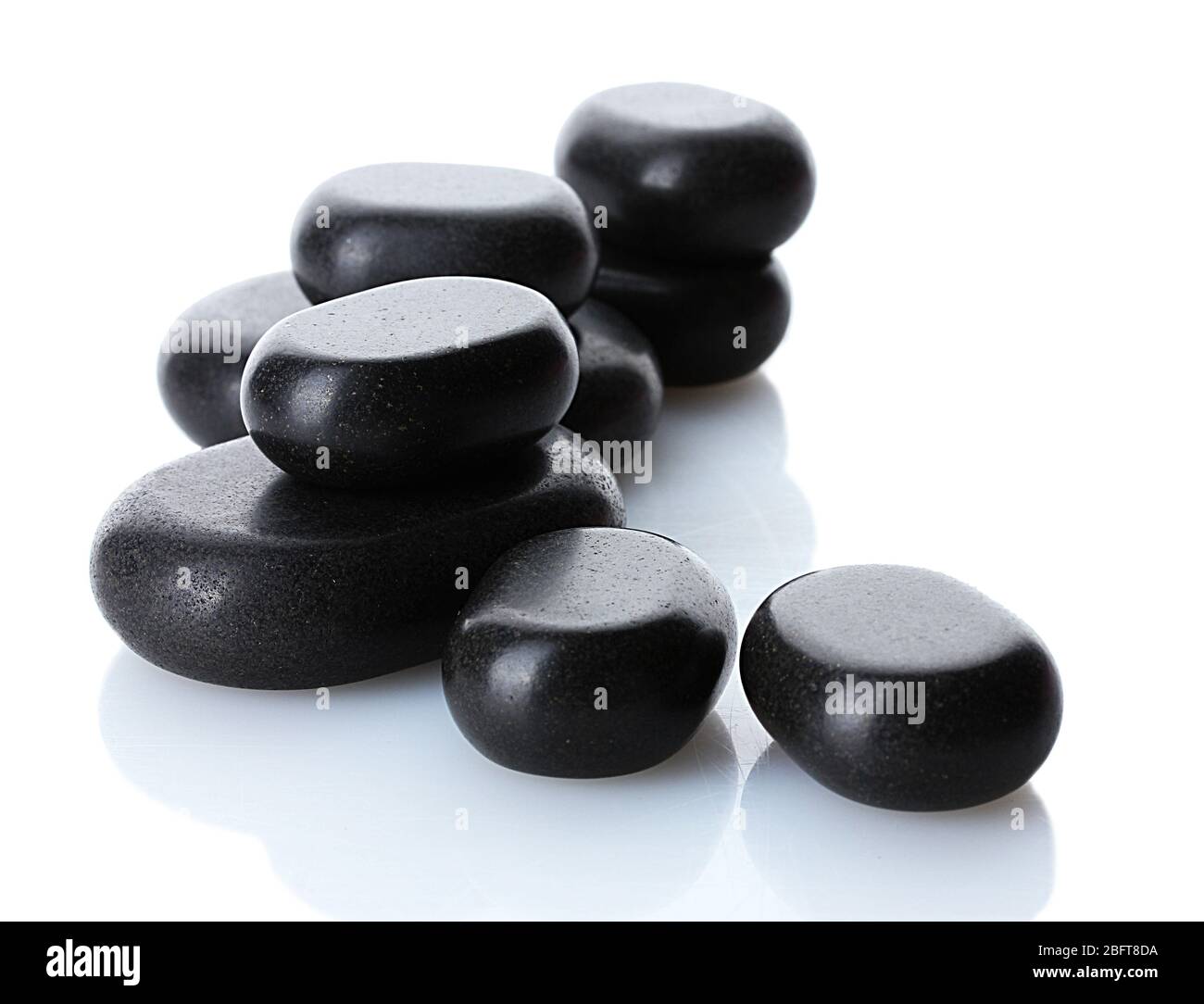 Spa stones isolated on white Stock Photo - Alamy