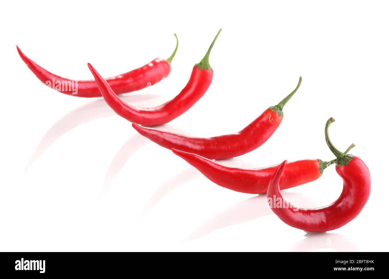 Red hot chili peppers isolated on white Stock Photo - Alamy