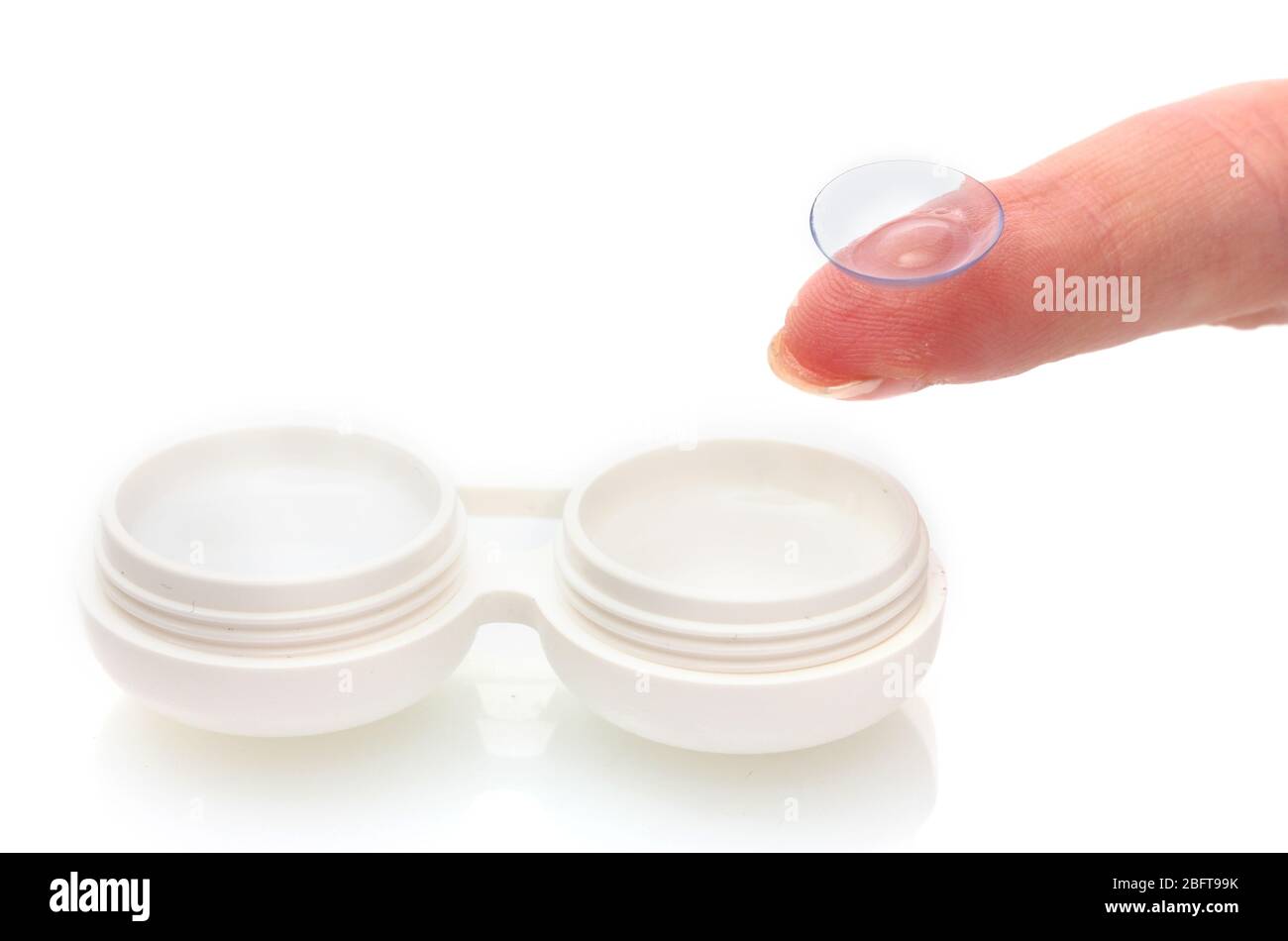 contact lens on finger and case isolated on white Stock Photo
