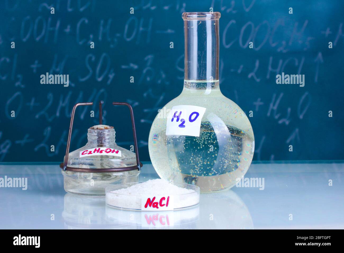 Test-tubes with various acids and other chemicals on the background of ...