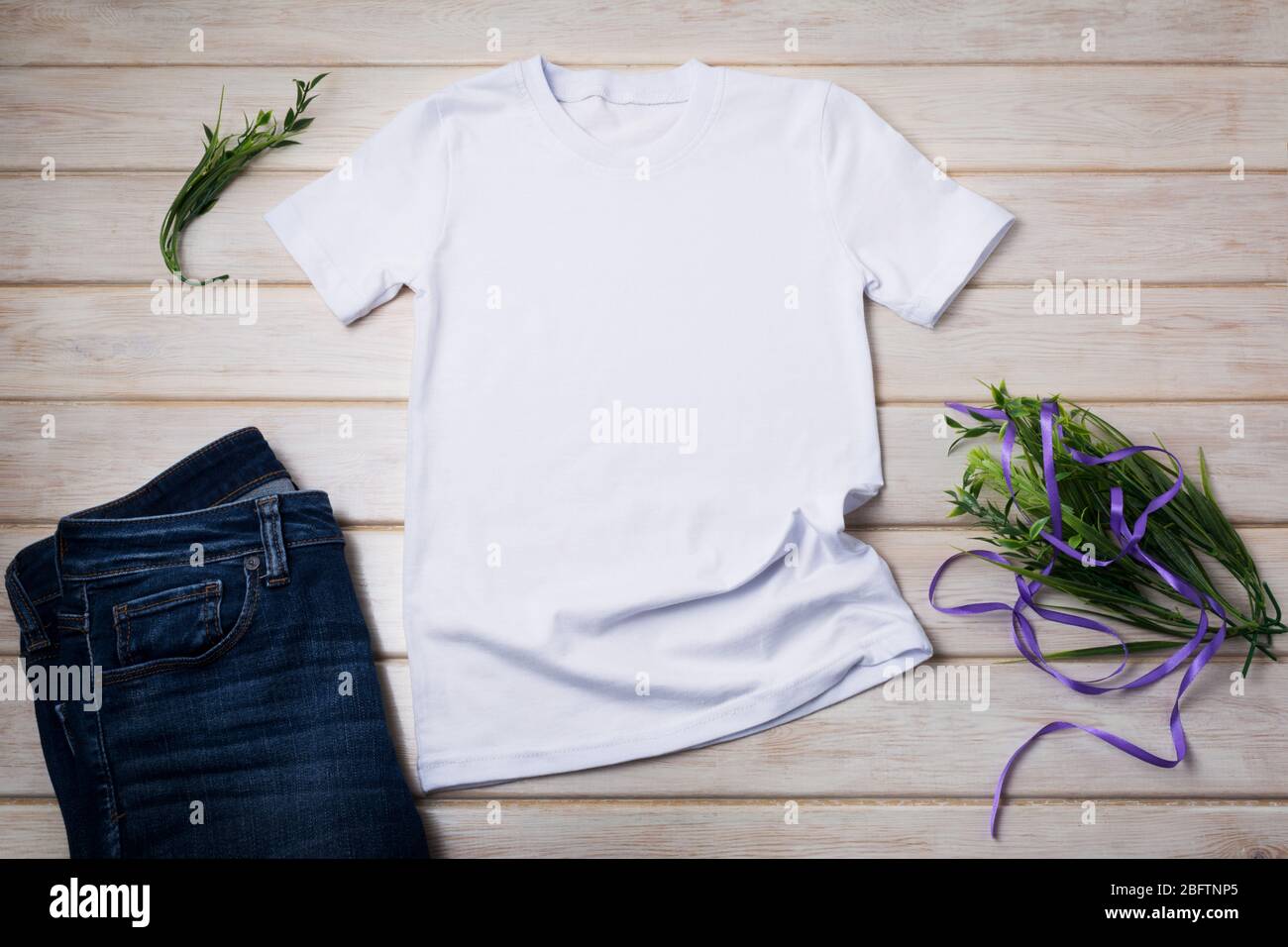 White Unisex Cotton T-Shirt Mockup With Jeans, Grass And Purple Ribbon.  Design T Shirt Template, Tee Print Presentation Mock Up Stock Photo - Alamy