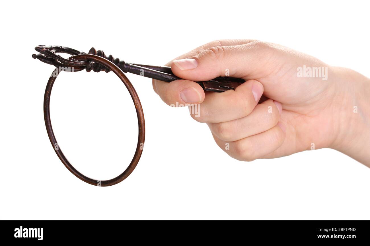 woman's hand holding an antique key on white background Stock Photo - Alamy