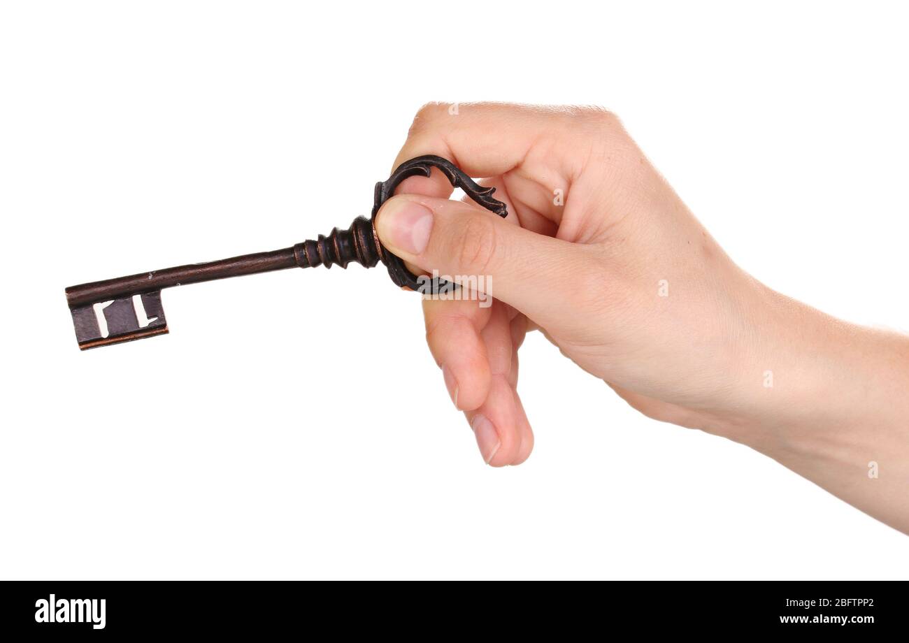 woman's hand holding an antique key on white background Stock Photo - Alamy
