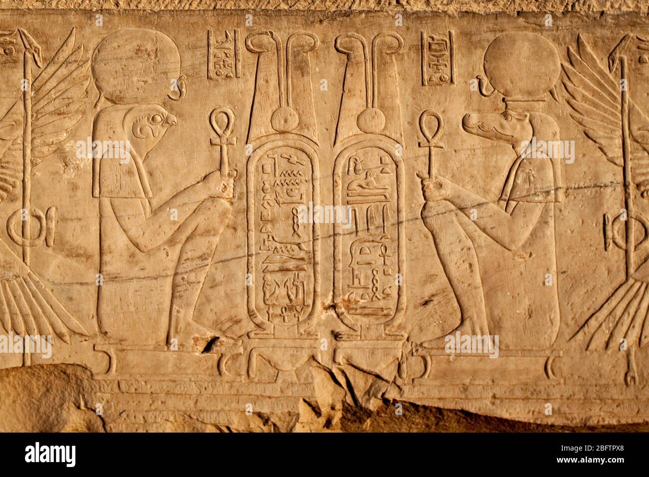 Bas Relief Carvings on a wall in the Kom Ombo Temple in Aswan, Upper Egypt. Stock Photo