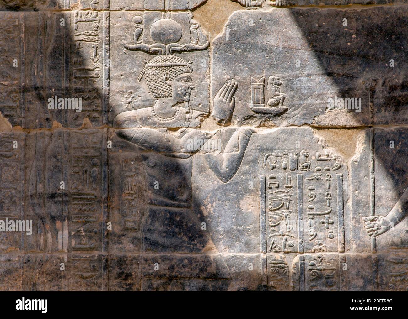 Hieroglyphics Reliefs on a wall at the Temple of Philae, Aswan, Egypt. Stock Photo