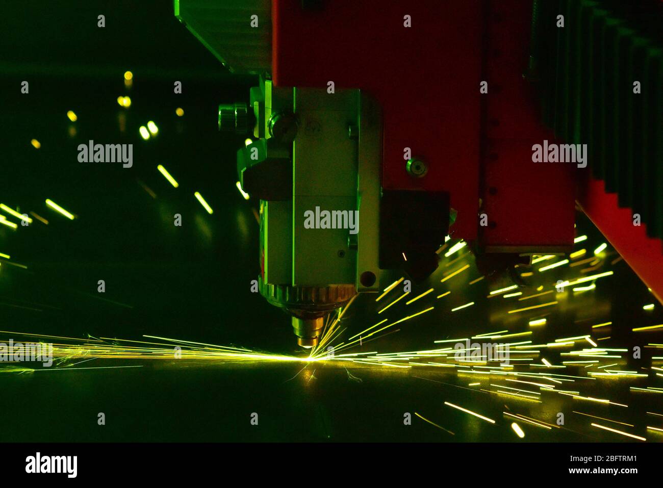Laser cutter, sheet metal is cut with laser, sparking, Switzerland Stock Photo