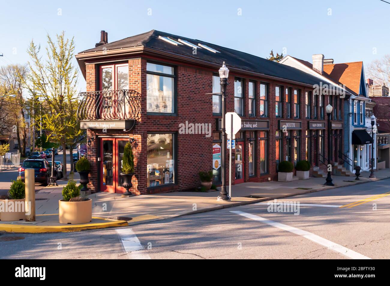 A two story brick building with retail shops along Ellsworth Avenue in