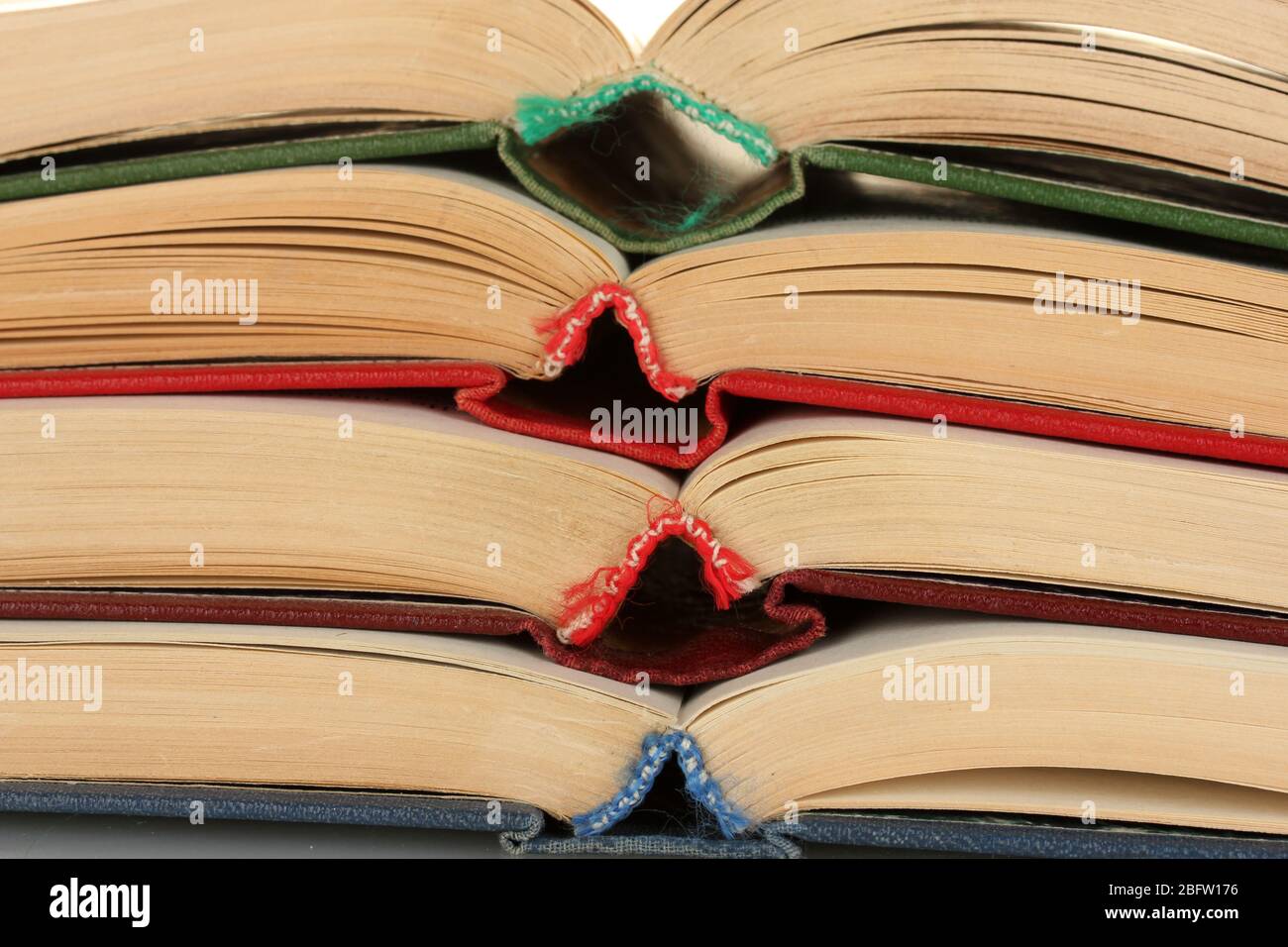 stack of open books close-up Stock Photo - Alamy
