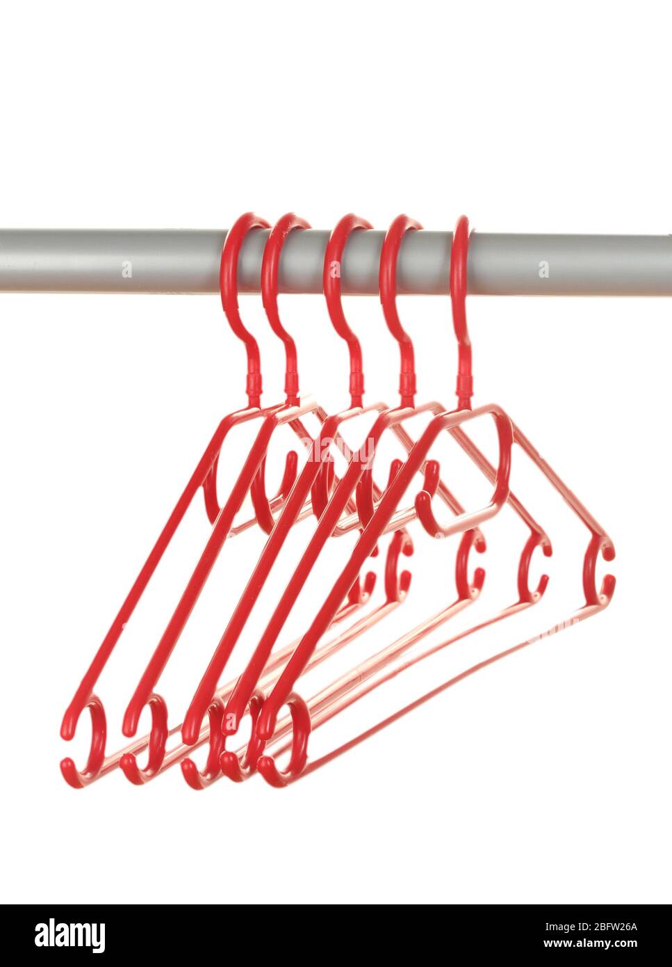 plastic hangers in row isolated on white Stock Photo Alamy