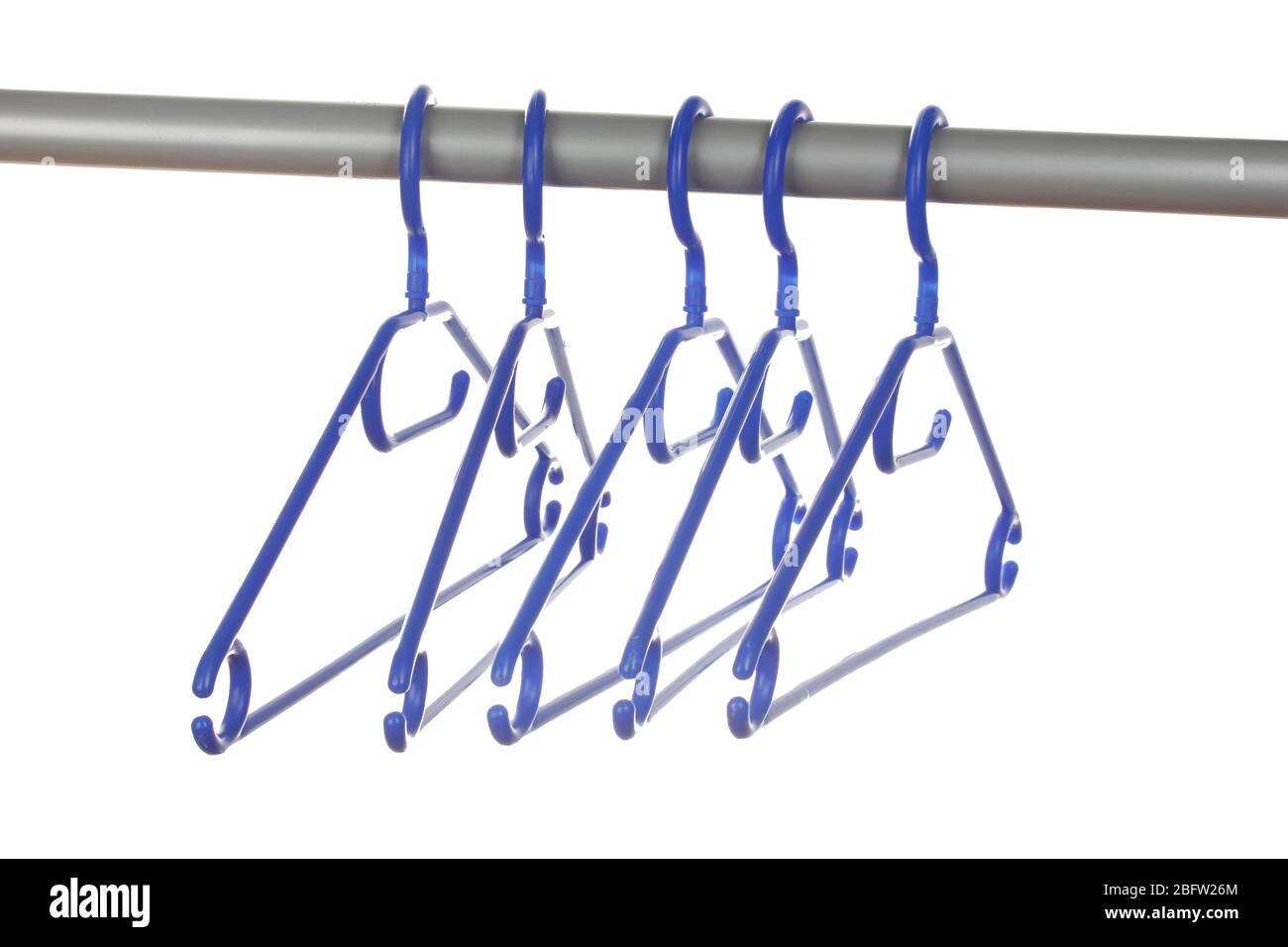 plastic hangers in row isolated on white Stock Photo