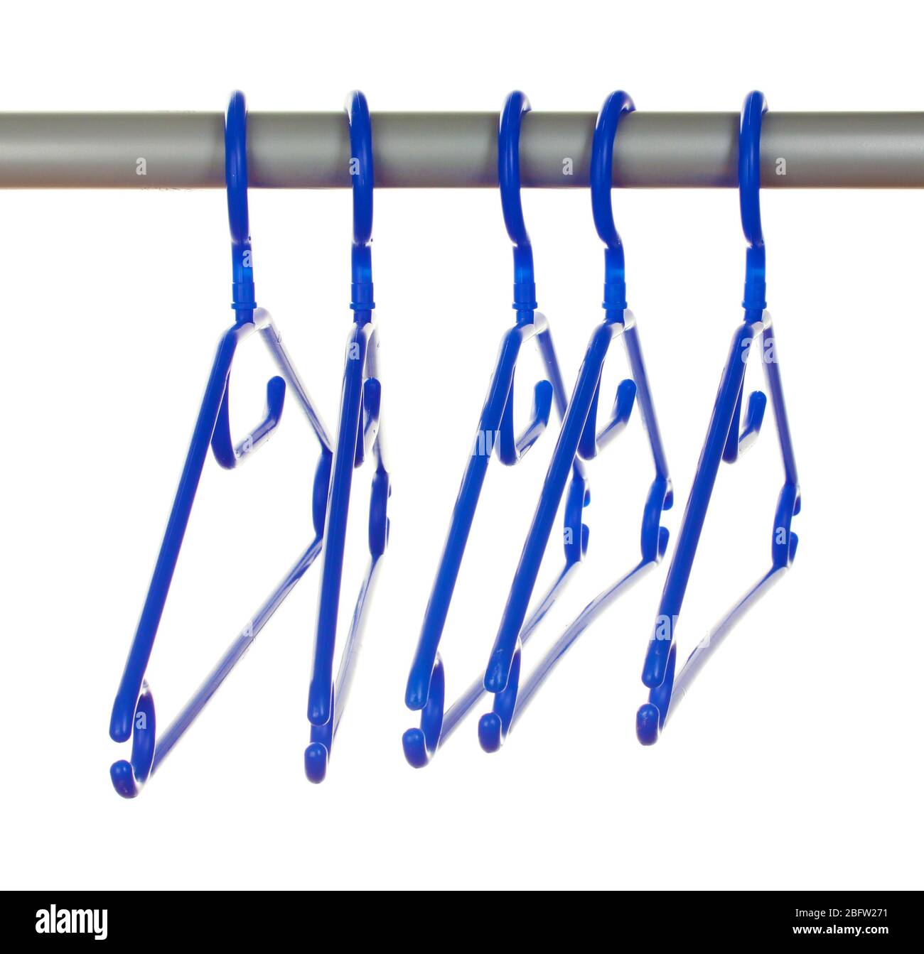 plastic hangers in row  isolated on white Stock Photo