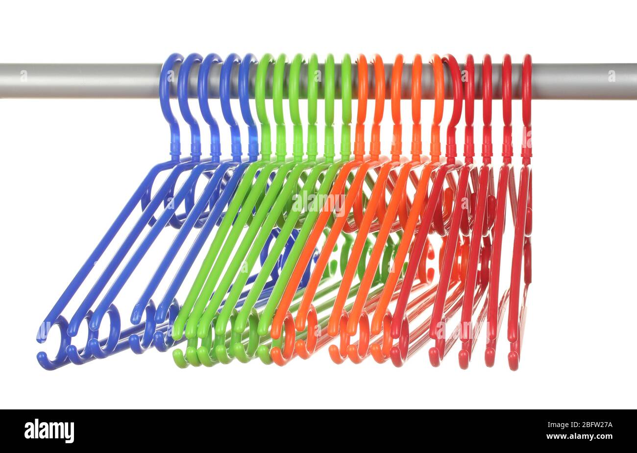plastic hangers in row  isolated on white Stock Photo