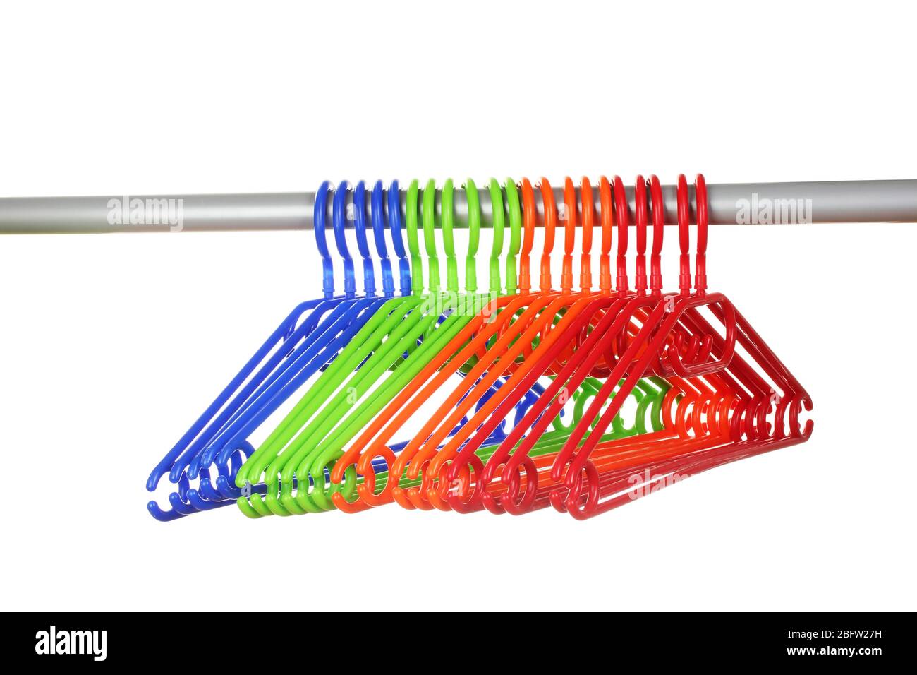 plastic hangers in row  isolated on white Stock Photo