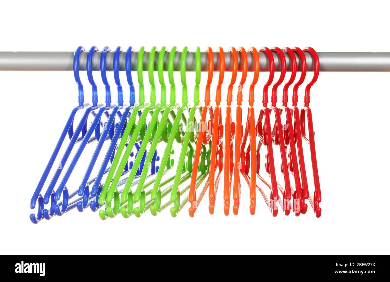 plastic hangers in row  isolated on white Stock Photo