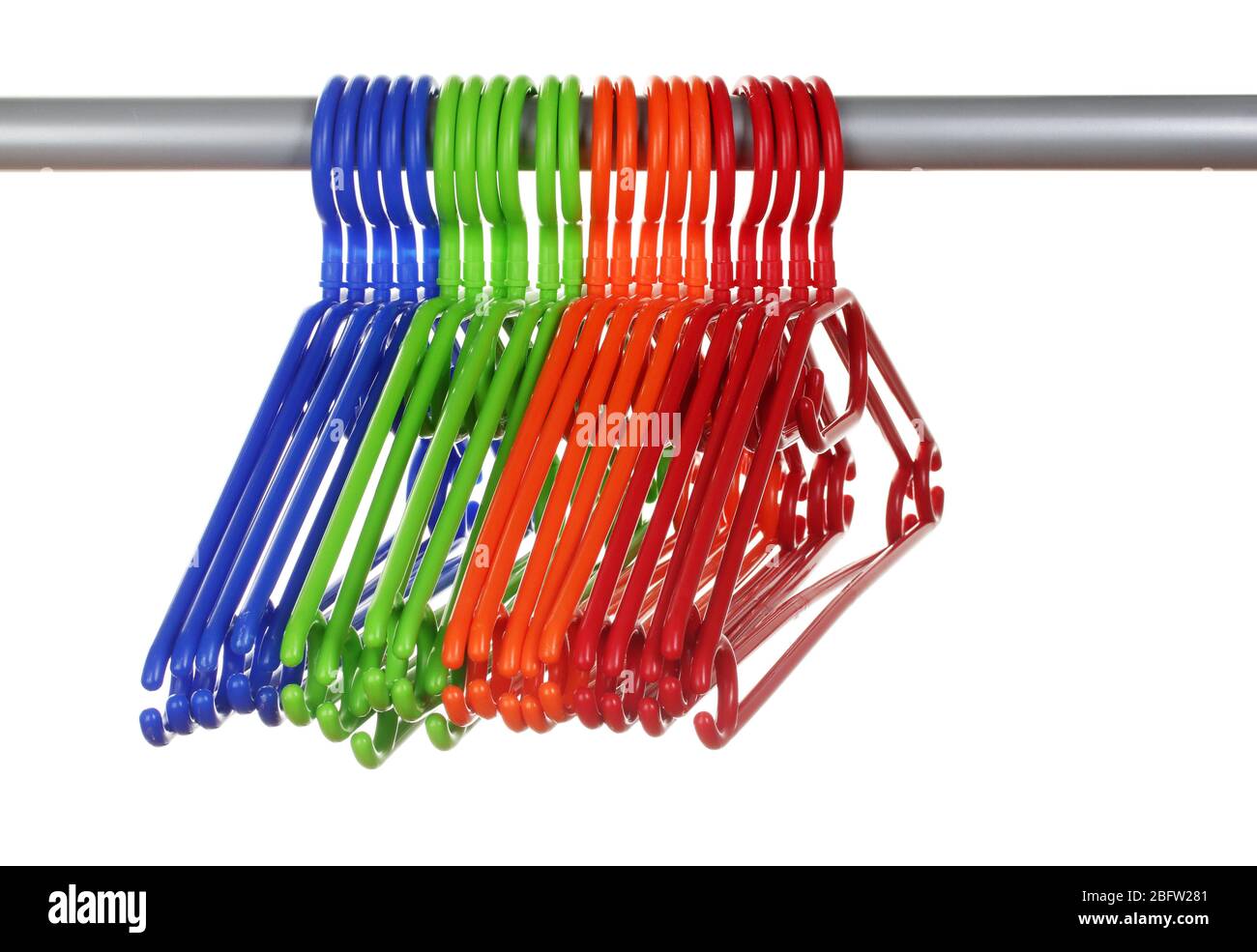 plastic hangers in row isolated on white Stock Photo