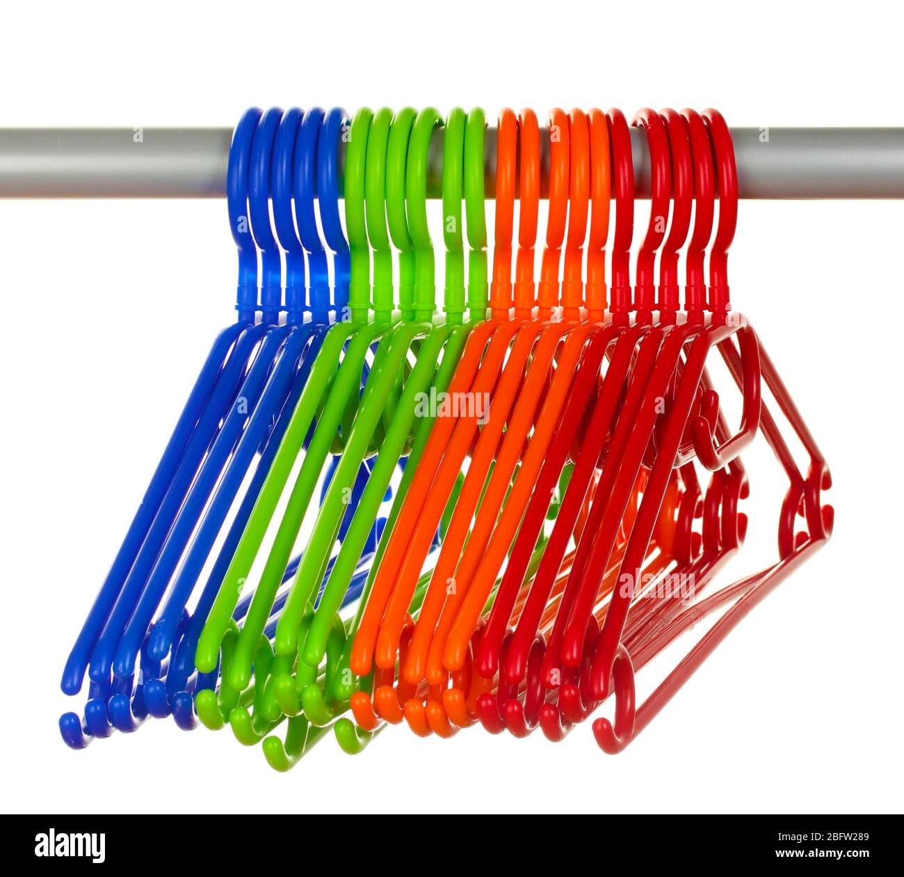 plastic hangers in row isolated on white Stock Photo