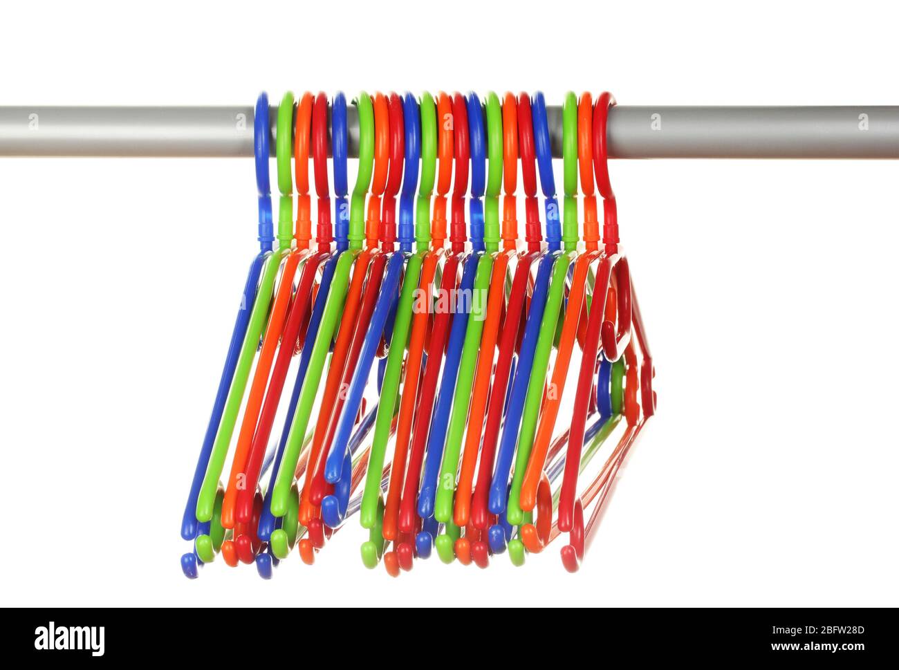 plastic hangers in row  isolated on white Stock Photo