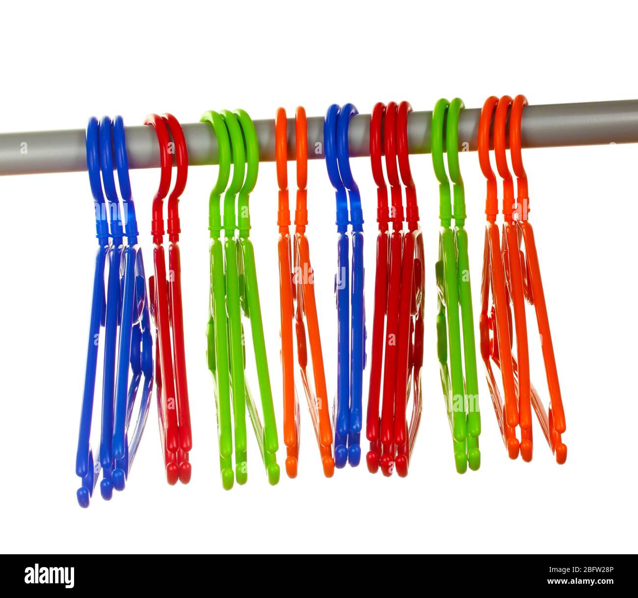 plastic hangers in row  isolated on white Stock Photo