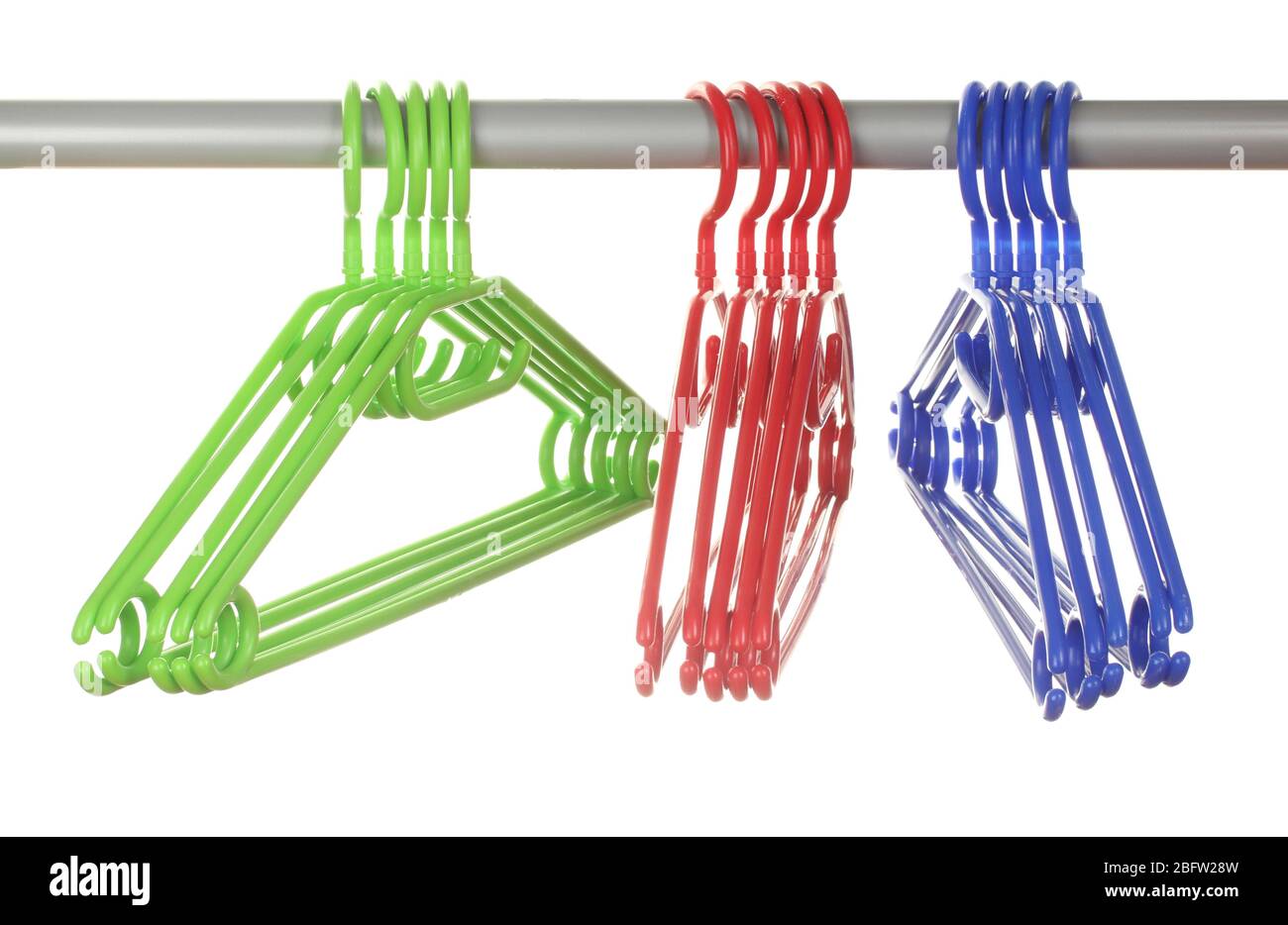plastic hangers in row  isolated on white Stock Photo