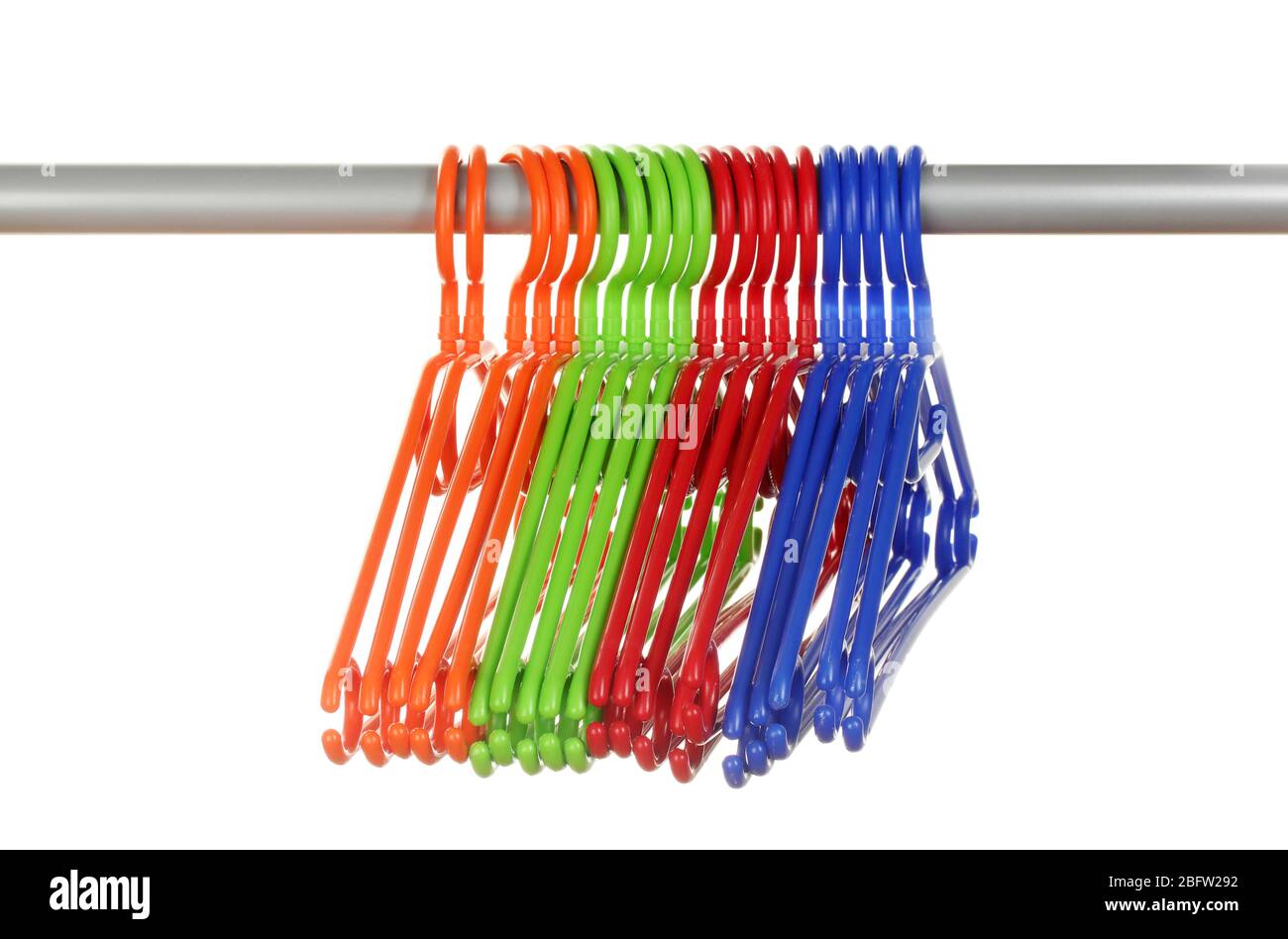 plastic hangers in row  isolated on white Stock Photo