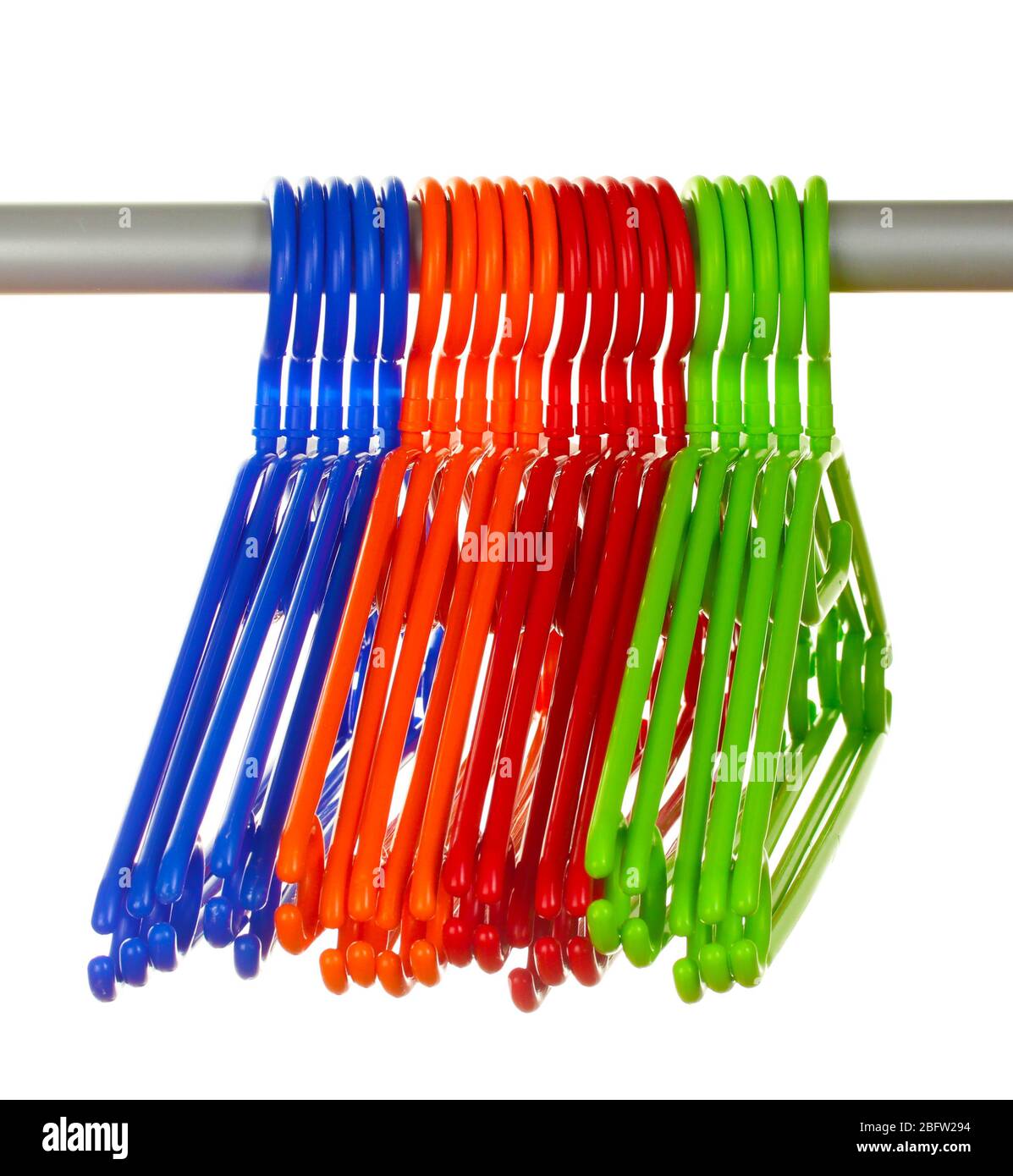 plastic hangers in row  isolated on white Stock Photo