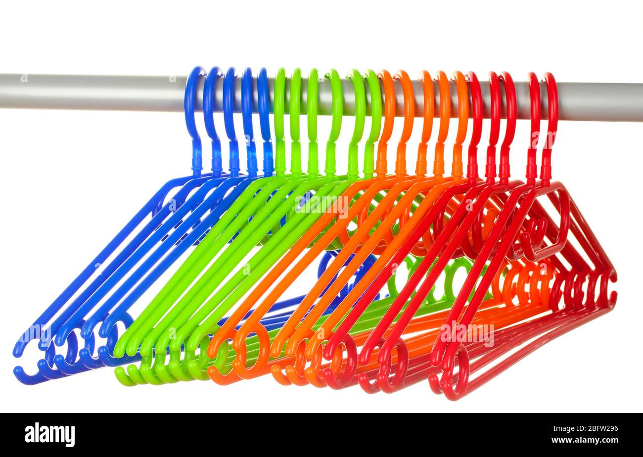 plastic hangers in row  isolated on white Stock Photo