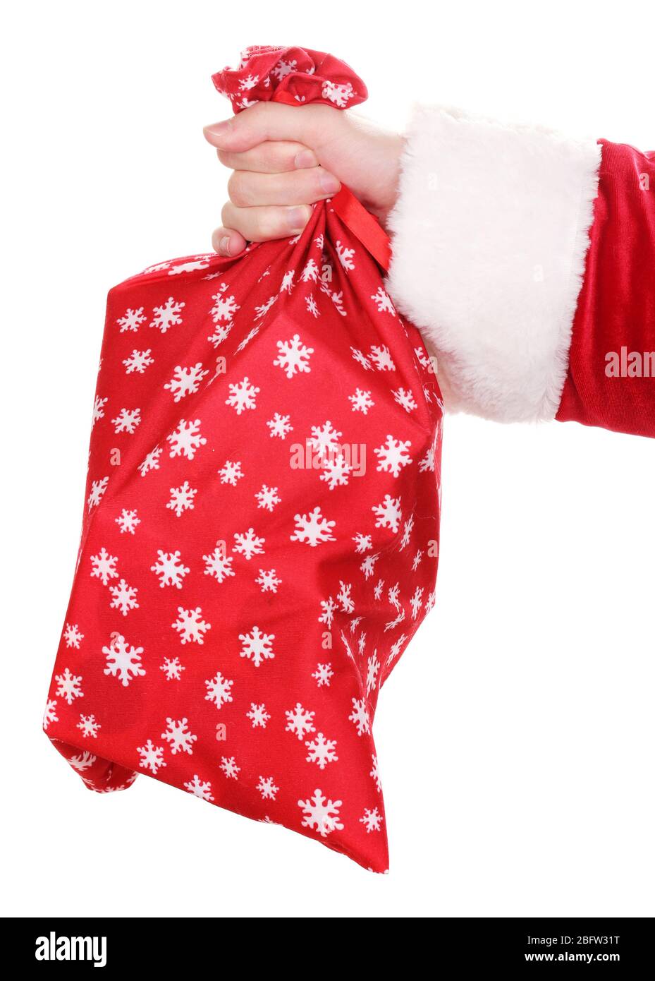 Santa Claus hand holding bag of gifts isolated on white Stock Photo - Alamy