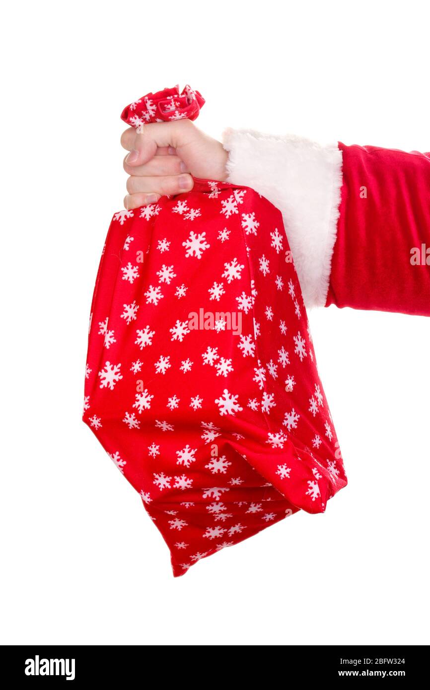 Santa Claus hand holding bag of gifts isolated on white Stock Photo - Alamy