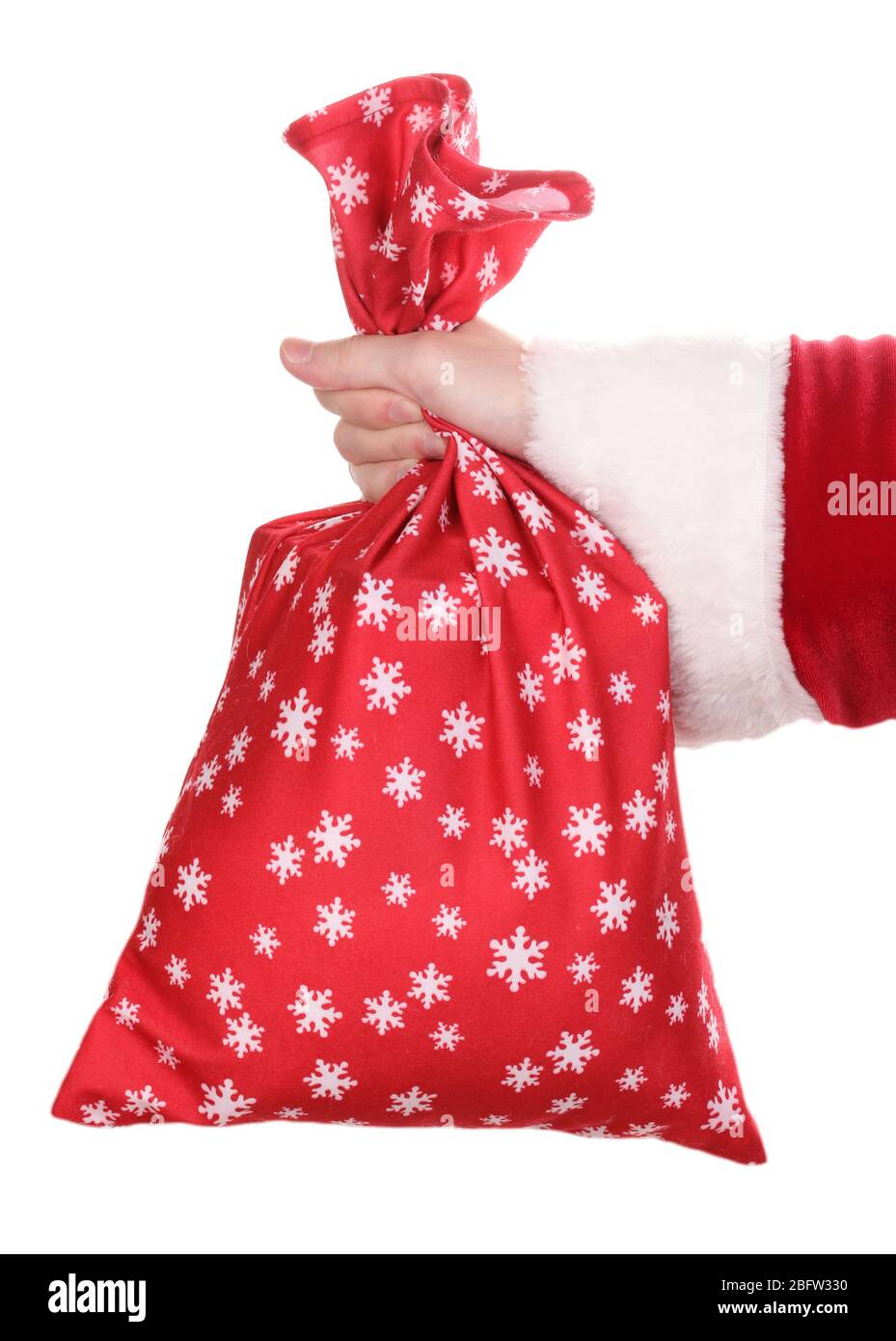 Santa Claus hand holding bag of gifts isolated on white Stock Photo - Alamy