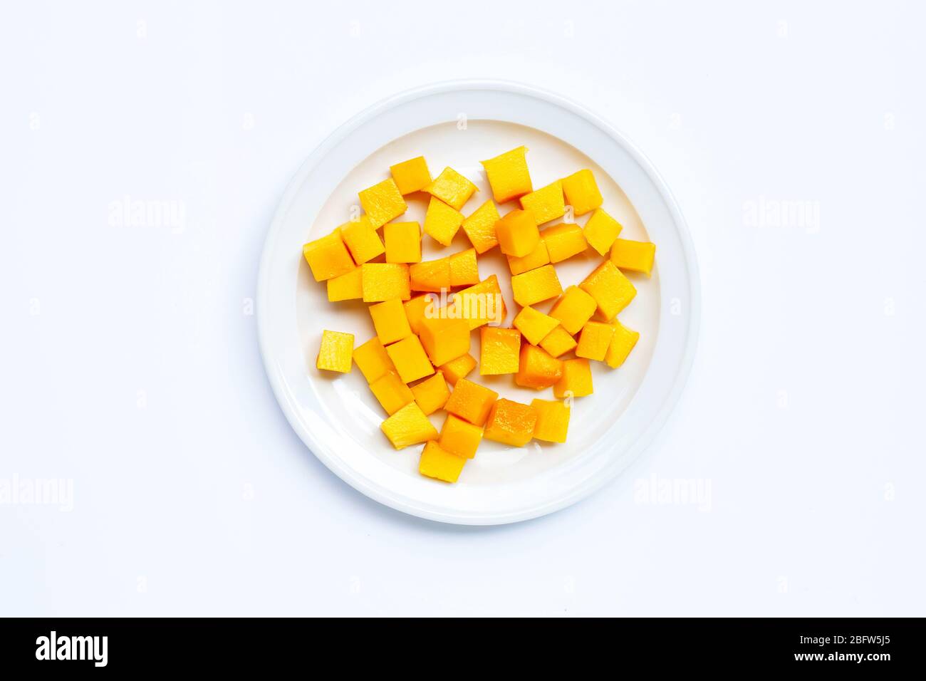 Tropical fruit, Mango cube slices on white background. Stock Photo