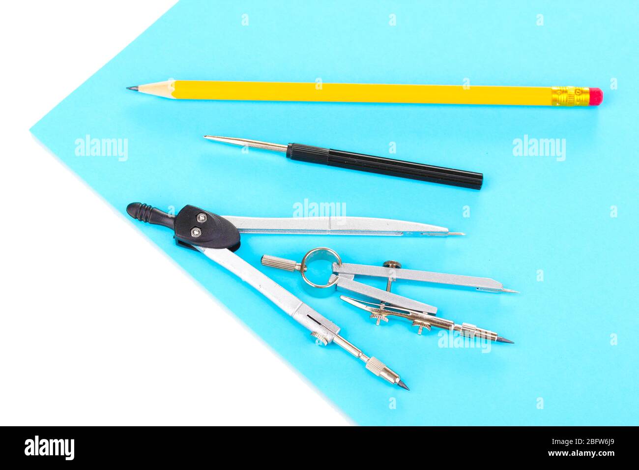 Drafting instruments on color paper isolated on white Stock Photo Alamy
