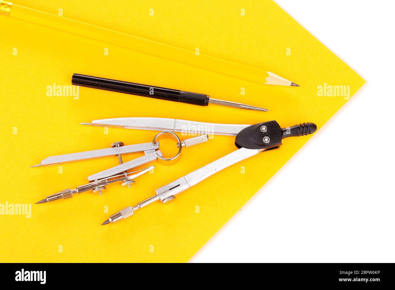 Drafting instruments on color paper isolated on white Stock Photo - Alamy