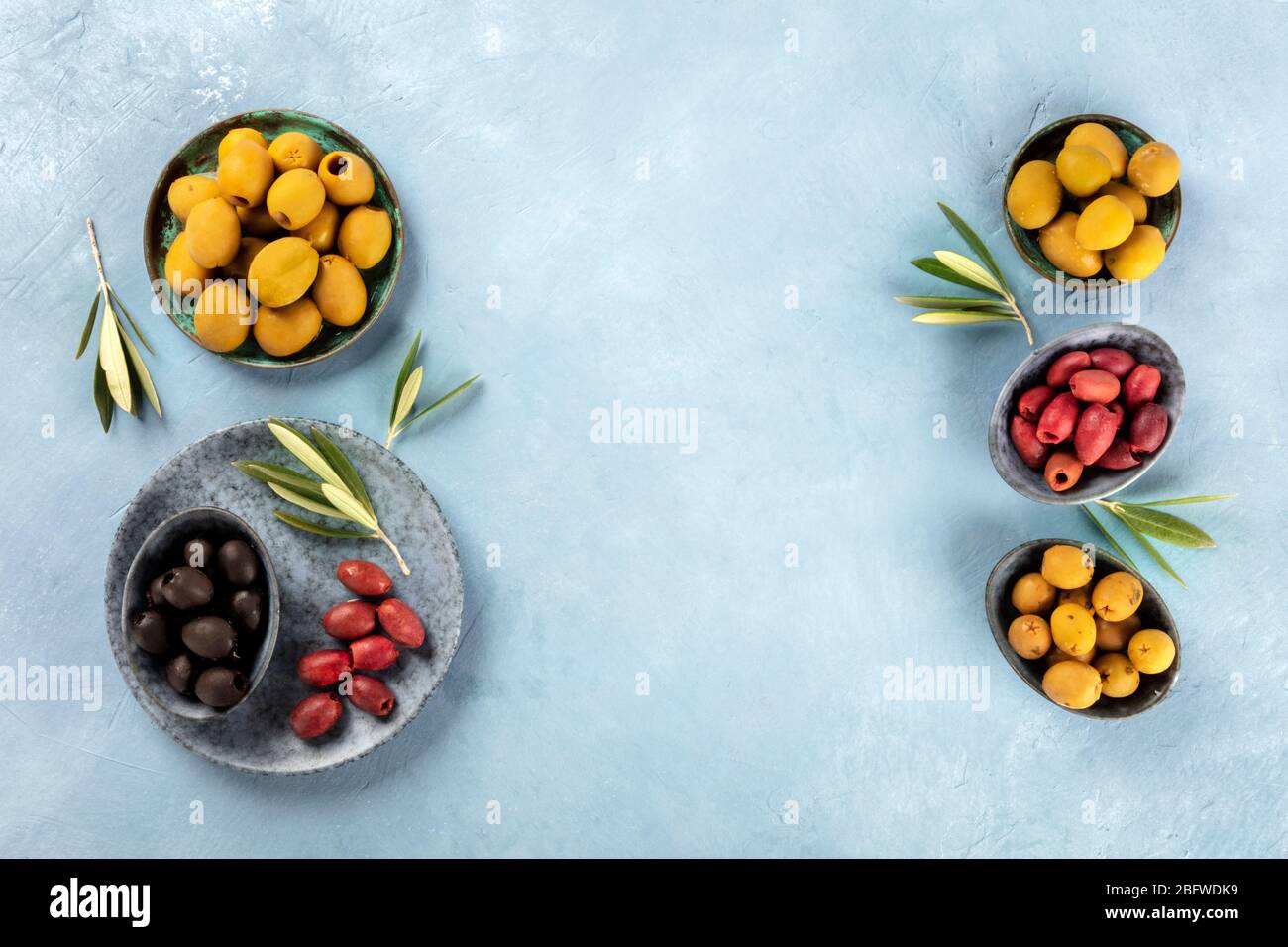 Olives, shot from above with copy space. An assortment of green, black and red olives Stock Photo