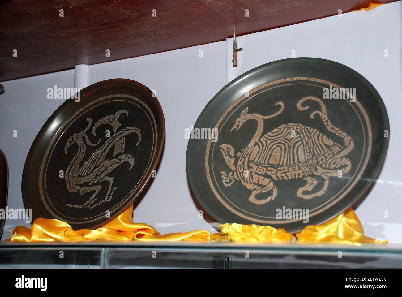 The Xixing pottery plate with Suzaku and basalt patterns in it and the Xixing Pottery Art Museum in Qinzhou City Guangxi Stock Photo
