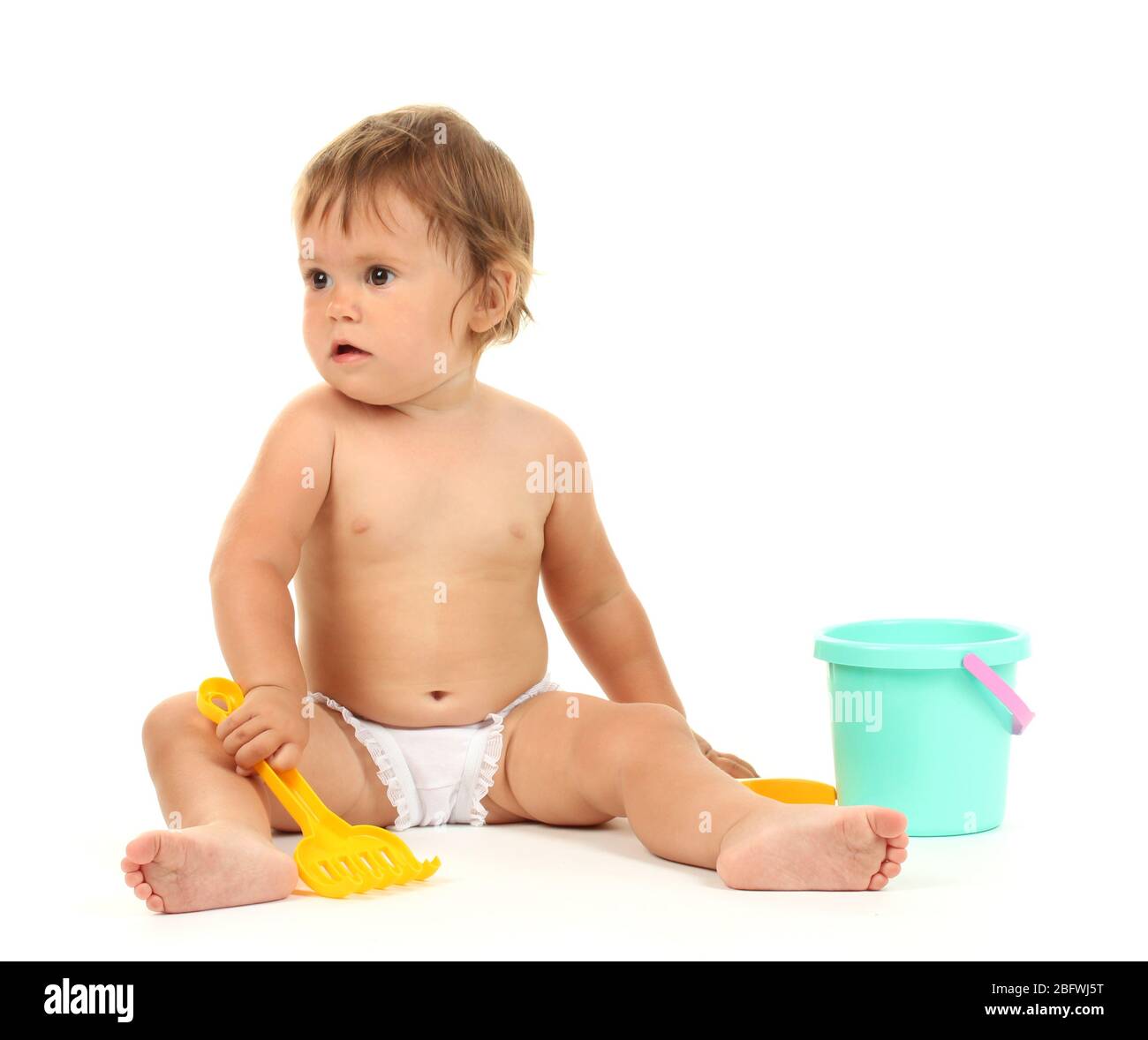 Cute baby with bucket and spade isolated on white Stock Photo Alamy