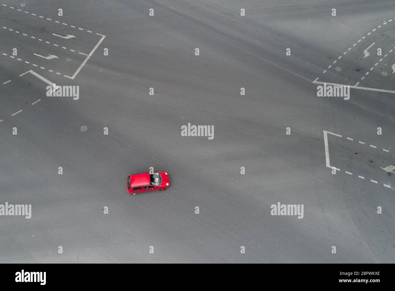 Aerial view of single car driving on intersection Stock Photo - Alamy