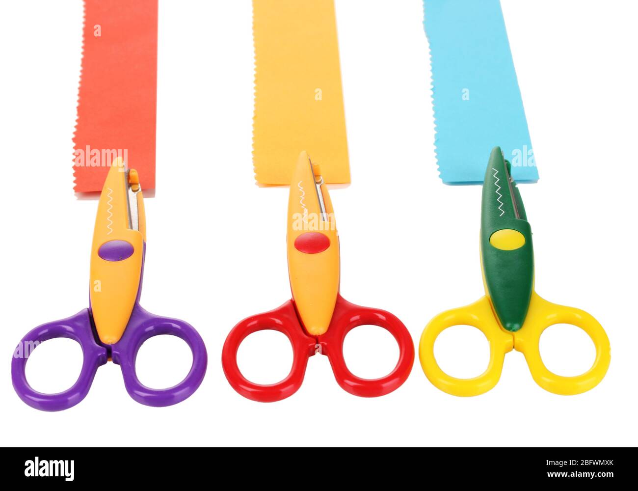 Colorful zigzag scissors with paper strips isolated on white Stock