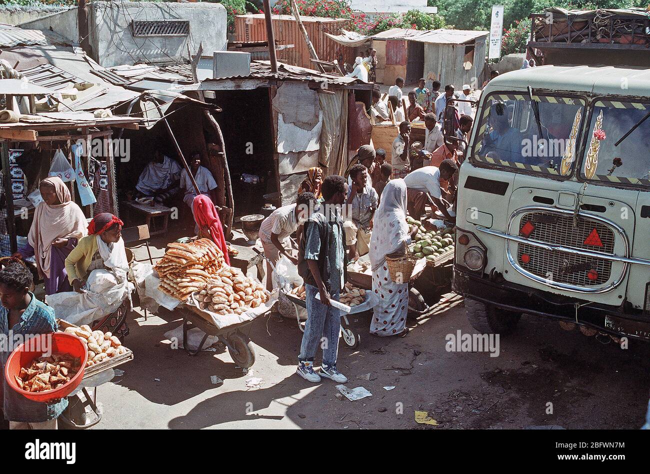 1992 - Somali vendors ply their wares on a busy city street during the multinational relief effort Operation Restore Hope. (Mogadishu Somalia) Stock Photo