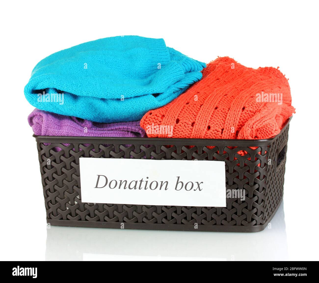 Donation box with clothing isolated on white Stock Photo - Alamy