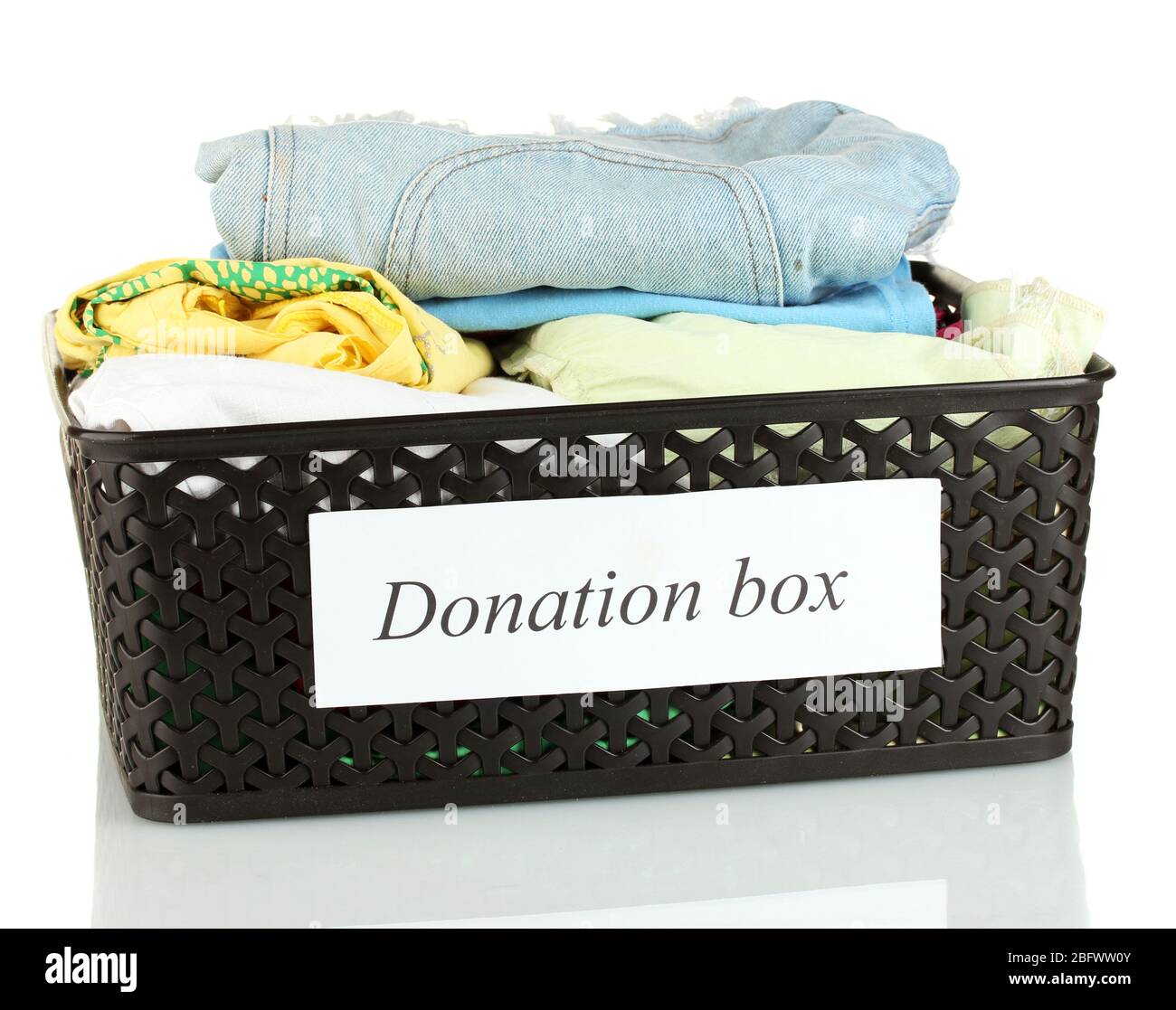 Donation box with clothing isolated on white Stock Photo - Alamy