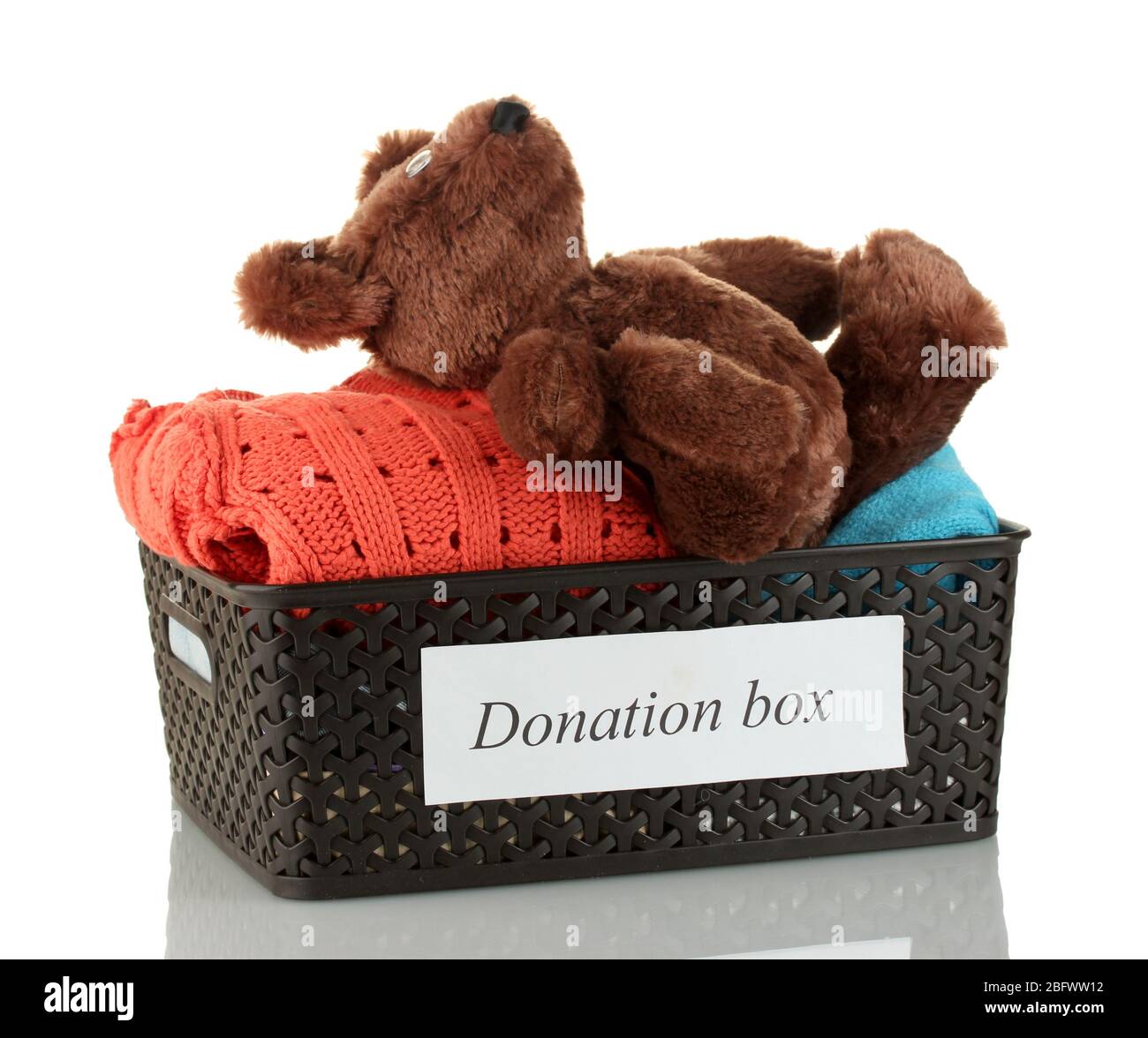 Donation box with clothing isolated on white Stock Photo - Alamy