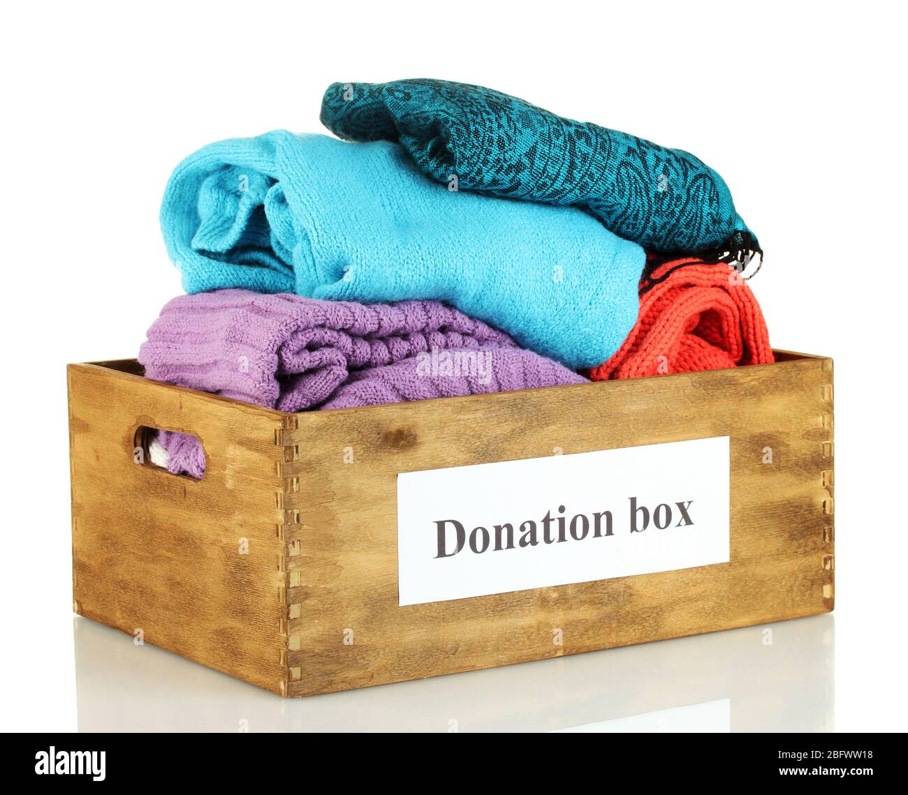 Donation box with clothing isolated on white Stock Photo - Alamy