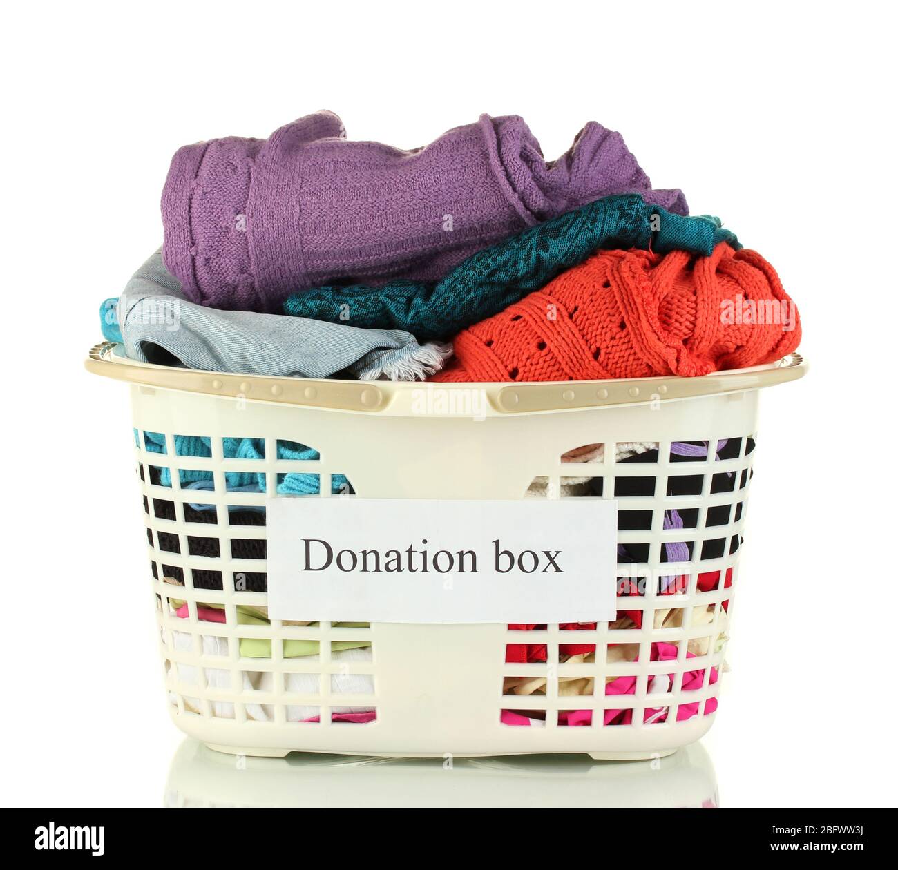 Donation box with clothing isolated on white Stock Photo - Alamy