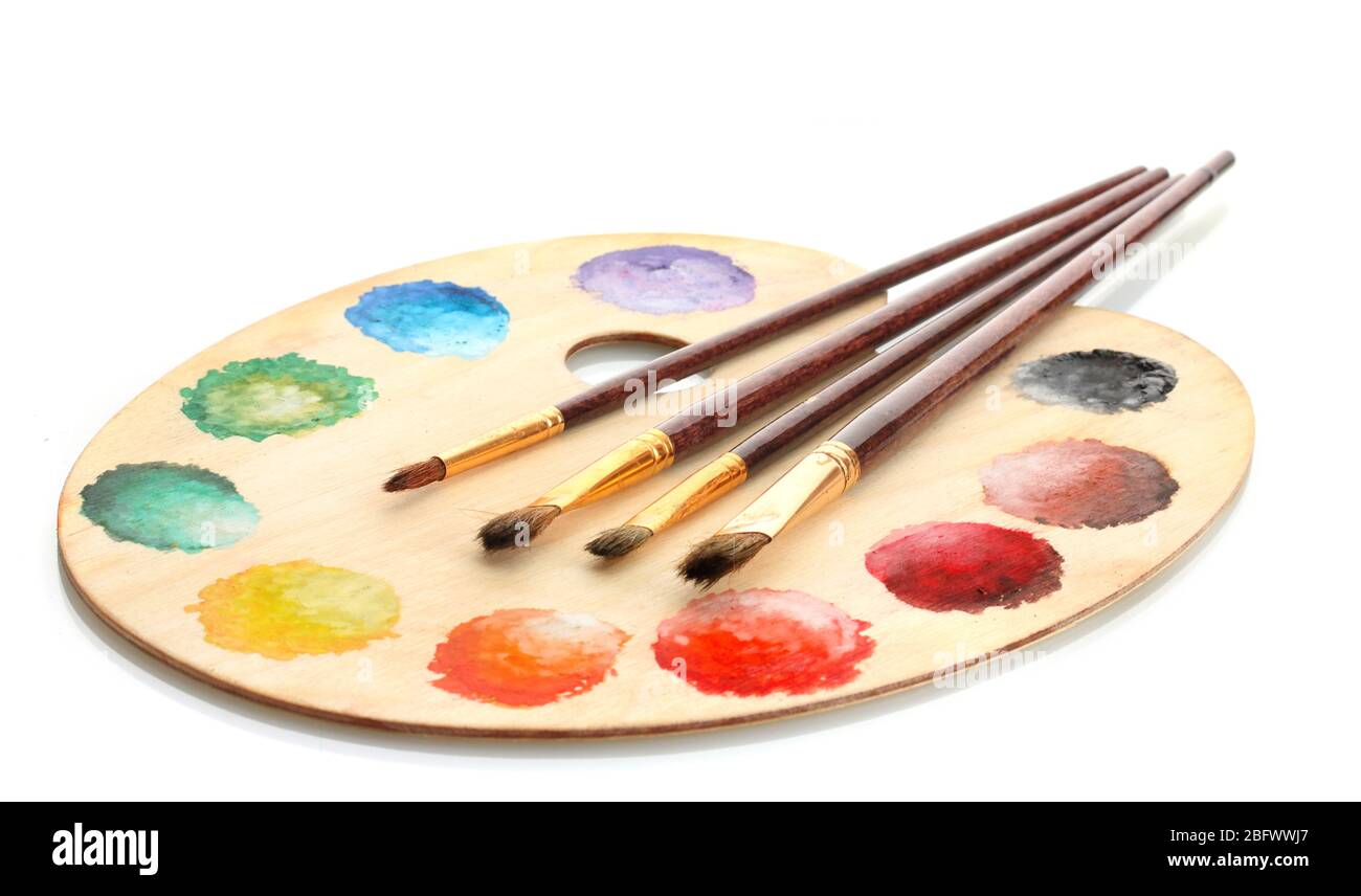 wooden art palette with paint and brushes isolated on white Stock Photo ...