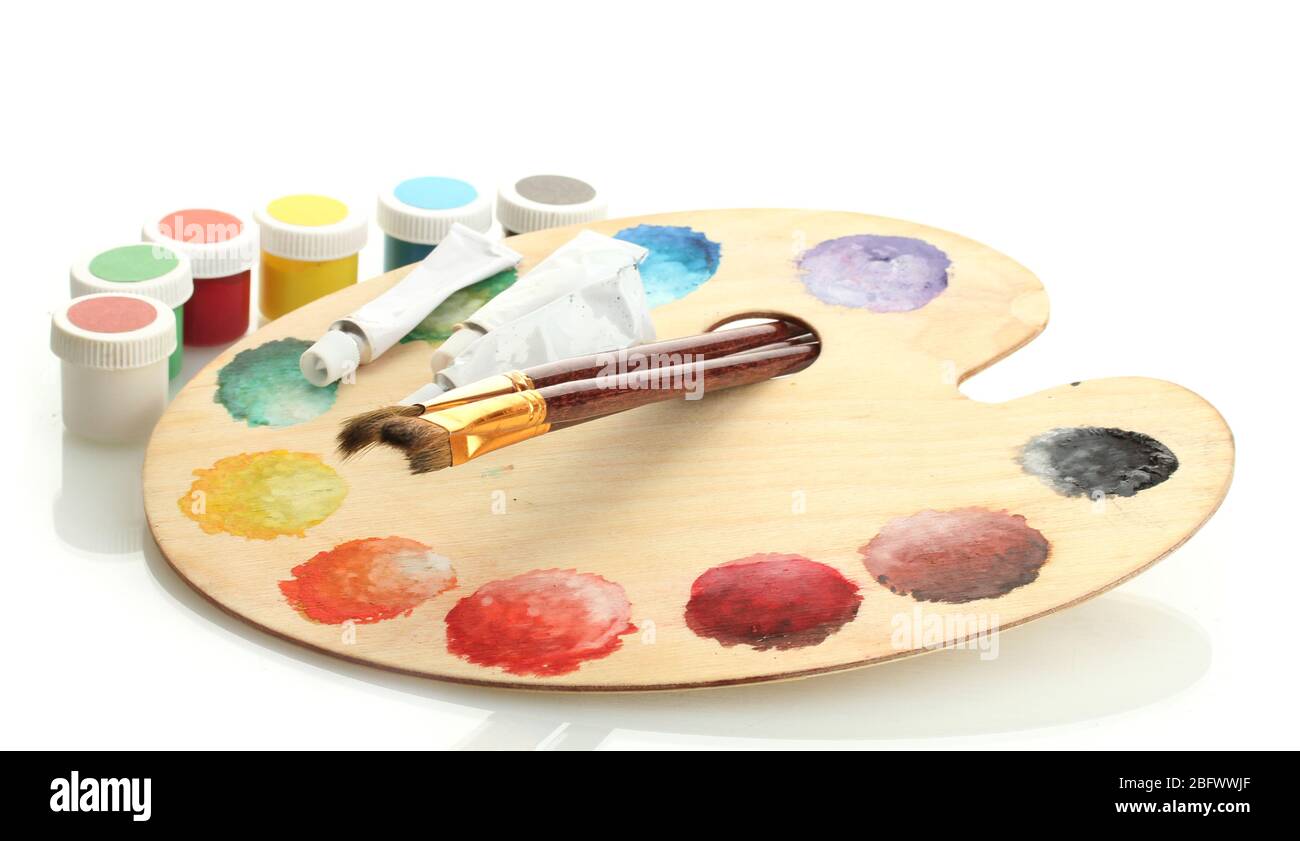 wooden art palette with paint and brushes isolated on white Stock Photo ...