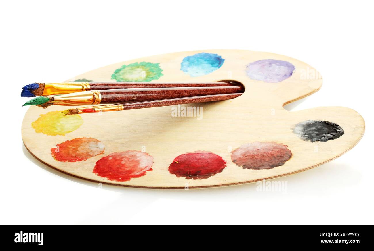 wooden art palette with paint and brushes isolated on white Stock Photo ...